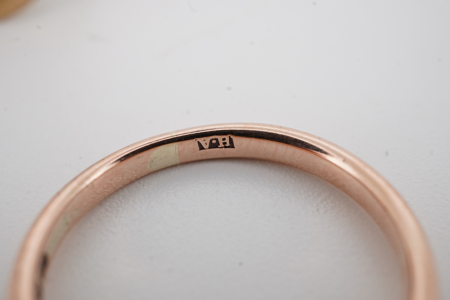 A 1940's platinum wedding band, with engraved inscription, size M, 2.3 grams together with a 9ct signet ring and a yellow metal wedding band.
